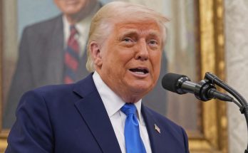 trump speaking at microphone