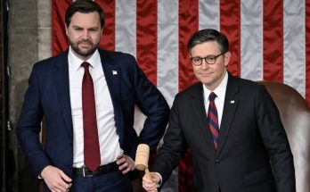 two officials with gavel