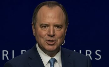 man speaking at podium