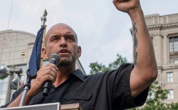 man speaking at rally
